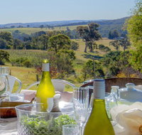 The Farmhouse - grape vines and rolling green hills